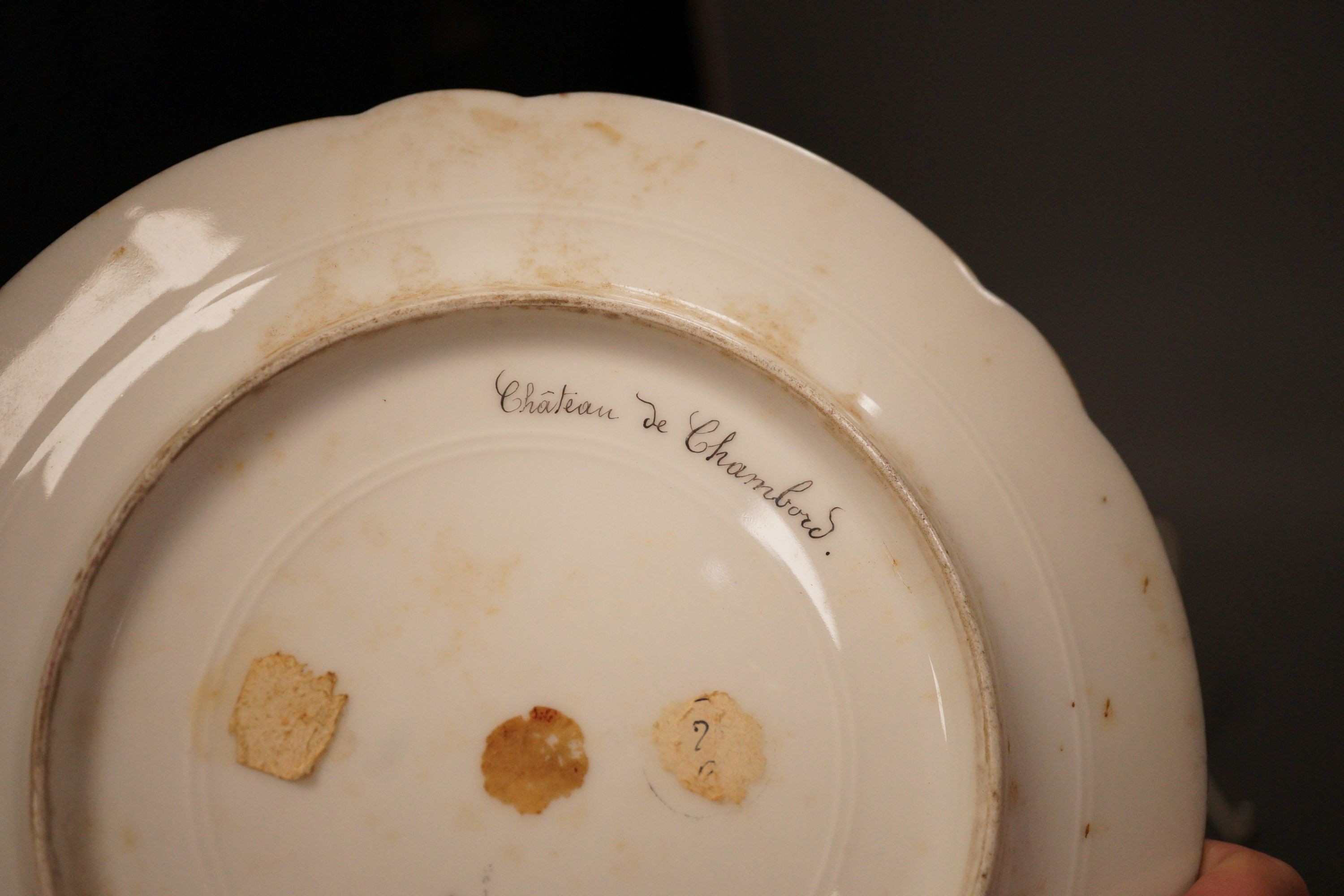 A 19th century Meissen sucrier, a Sevres style Chateau de Chambord plate and a pair of Paris porcelain scent bottles